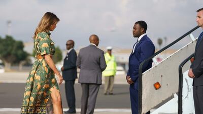 Here she is leaving Kenya in an animal print dress by an unidentified designer and Manolo Blahnik shoes.
