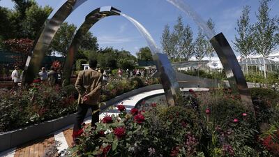 A visitor walks into a show garden 'Positively Stoke-on-Trent' AP