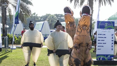 Participants running the Inflatathon obstacles course. Leslie Pableo for The National