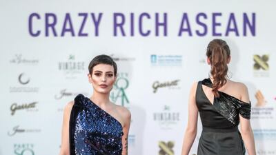 Fashion by Filipino designers Jose and Aldwin Guardiana.