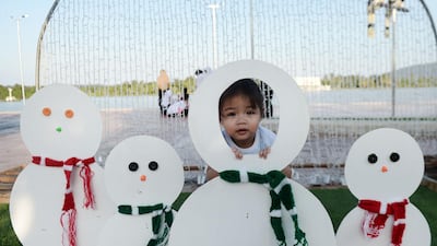 A child playing amid decorations for Christmas in the southern Thai province of Narathiwat. AFP
