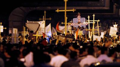 Egyptian Christians march in Cairo during a protest against an attack on a church in southern Egypt, October 9, 2011. Nineteen people were killed in Cairo on Sunday when Christians, some carrying crosses and pictures of Jesus, clashed with military police???