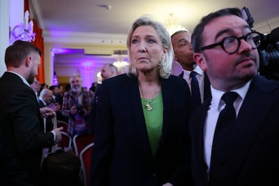 French far-right leader Marine Le Pen leaves Jordab Bardella's new year speech to the press. Reuters