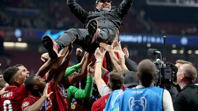 Jurgen Klopp is lifted up by his players after winning the Champions League at the Wanda Metropolitano in Madrid. PA