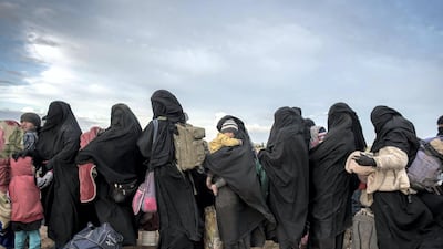 Women and children wait to be screened. Campbell MacDiarmid / The National