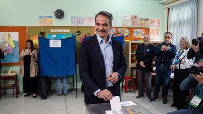 Mr Mitsotakis casts his ballot at an Athens polling station. Bloomberg