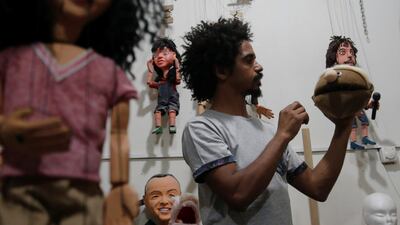 Egyptian puppeteer Mohamed Fawzy Bakkar, 35, creates marionettes in his workshop in Cairo. Reuters