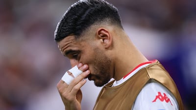 Tunisia's Hadj Mahmoud looks dejected after his side's World Cup exit was confirmed. Reuters