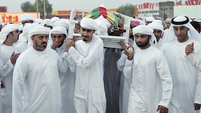 Readers console the family and friends of Jassim Al Baloushi. Satish Kumar / The National
