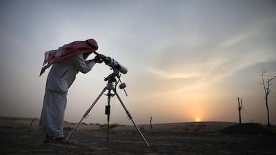 A member of the official moon spotting team uses his telescope to look for the moon to signal the start of Ramadan. August 10, 2010. Galen Clarke / The National