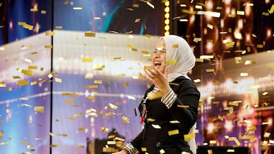 Putri Ariani from Indonesia gets Simon Cowell's golden buzzer. Getty Images