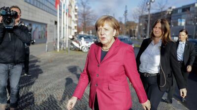 Angela Merkel arrives at the CDU headquarters for further talks with members of potential coalition parties. AFP/DPA/Kay Nietfeld