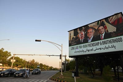 An electronic board in Islamabad displays, from left, Pakistani Prime Minister Shehbaz Sharif, Iranian President Masoud Pezeshkian and Pakistani President Asif Ali Zardari. AFP