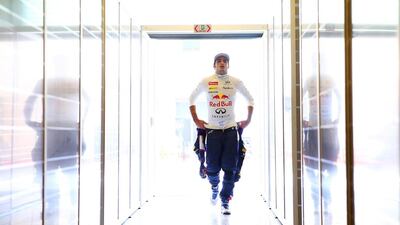 Carlos Sainz Jr. of Spain and Infiniti Red Bull Racing walks into the garage during day one of Formula One testing at Yas Marina Circuit on November 25, 2014 in Abu Dhabi, United Arab Emirates. (Photo by Dan Istitene/Getty Images)