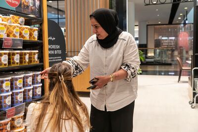 Ms Ebrahim says the store area that requires the most restocking is the mini bite buckets. Antonie Robertson / The National