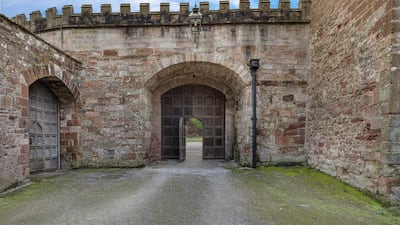 The castle structure is complete with a Norman keep and 13th-century round tower
