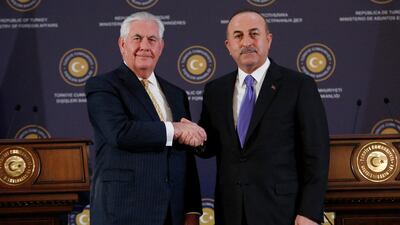 US Secretary of State Rex Tillerson shakes hands with Turkish Foreign Minister Mevlut Cavusoglu after their press conference in Ankara, Turkey. Tumay Berkin / EPA