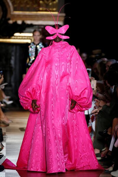 A shocking pink watered silk gown from Schiaparelli. Reuters