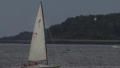 The Super Blood Moon rises over a sailboat in Boston Harbor on September 27, 2015 in Boston, Massachusetts. The Super Moon coincides with a total lunar eclipse, a rare combination that last occurred in 1982. Scott Eisen / Getty Images / AFP