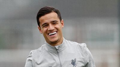 Liverpool's Philippe Coutinho smiles during a training session. Craig Brough / Reuters