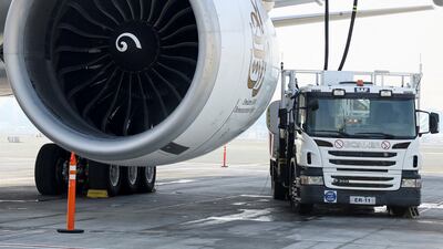 An Emirates Airlines Boeing plane is filled with sustainable aviation fuel. Reuters