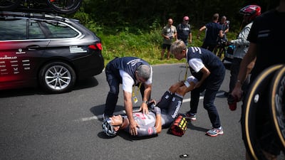 Belgium's Jonas Rickaert receives assistance after crashing during Stage 12. AP