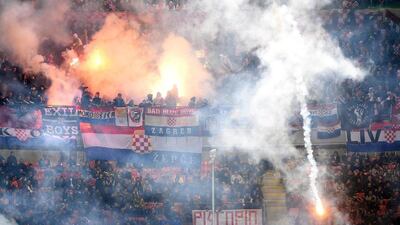 Croatia's supporters light flares during their team's Euro 2016 qualifying match against Italy on Sunday at the San Siro in Milan. Daniel Dal Zennaro / EPA