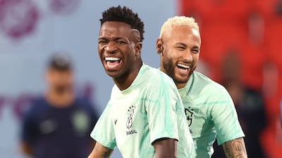 Neymar jokes with teammate Vinicius Junior during a training session at Al Arabi SC Stadium on December 8, 2022. Getty