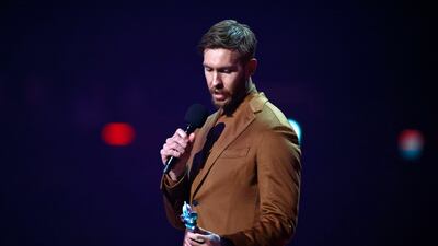Calvin Harris with his Brit Award for Best Dance Act onstage. EPA