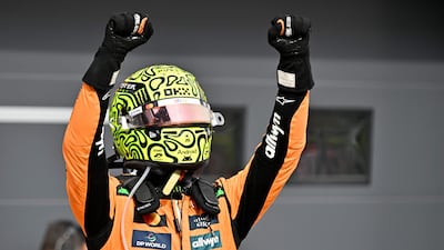 McLaren's British driver Lando Norris celebrates after winning the Hungarian GP. AFP