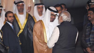 Indian Prime Minister Narendra Modi greets the Crown Prince of Abu Dhabi, Sheikh Mohammed bin Zayed, after he arrived at an air force base in New Delhi. Prakash Singh / AFP Photo