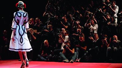 Photographers crowd to shoot the runway at the Dolce & Gabbana show. Alessandro Garofalo / Reuters