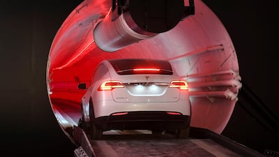 A modified Tesla Model X drives into the tunnel entrance before an unveiling event for the Boring Company Hawthorne test tunnel in Hawthorne, California. Reuters