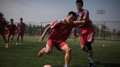 Students take part in an under-14 training session at the Pyongyang International Football School. Ed Jones / AFP