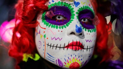 It's fright night as a woman takes part in La Catrinas Parade, ahead of the Day of the Dead celebration, in Mexico City. AFP