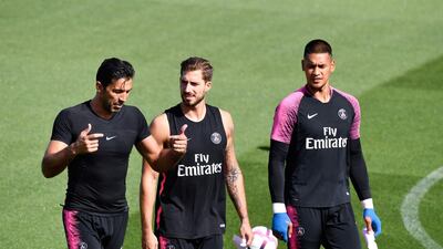 Bufon, Trapp and French goalkeeper Alphonse Areola walk on the pitch during a training session. AFP