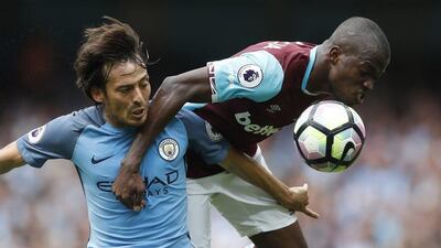 West Ham United forward Enner Valencia in action with Manchester City midfielder David Silva. Carl Recine / Reuters