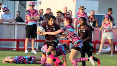 Match between Al Maha, black, and Dubai Sharks on the second day of the Emirates Dubai Rugby Sevens series on December 3, 2021. Pawan Singh / The National
