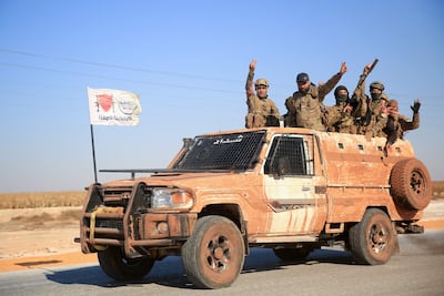 Anti-government fighters in Aleppo after their surprise attack on the Syrian city. AFP