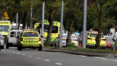 Ambulances parked outside a mosque in central Christchurch after the mass shooting that left several dead. AP Photo