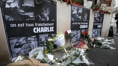 Flowers at the Charlie Hebdo newspaper offices in Paris. Photo: Francois Mori / AP