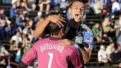San Jose Earthquakes goalkeeper David Bingham is congratulated by teammate Jason Hernandez after scoring from his own box in a pre-season friendly against West Bromwich Albion.