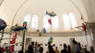 Philippe Parreno's floating fish ('My Room Is Another Fishbowl') in Jaou Tunis's "water" pavilion, held in a French colonialist church turned boxing ring 