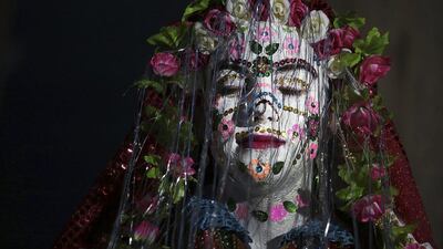 A Bulgarian Muslim bride has her face decorated on February 23, 2014, at the end of a two-day wedding ceremony in the mountain village of Ribnovo, 200 kilometres south of the capital Sofia The remote village in south-west Bulgaria has kept its traditional winter marriage ceremony alive despite decades of Communist persecution and poverty. The wedding ritual was resurrected among the Pomaks — Slavs who converted to Islam under Ottoman rule. The highlight of the ceremony is the painting of the bride’s face. In a private rite, her face is covered in thick, chalky white paint and decorated with colourful sequins. Valentina Petrova / AP photo
