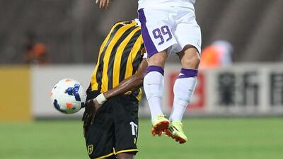 Al Ain's Miroslav Stoch, in white, vies with Al Ittihad's Saleh al Qumayzi during their AFC Champions League football match at the King Abdulaziz Sport City on August 26, 2014 in Mecca. AFP PHOTO
