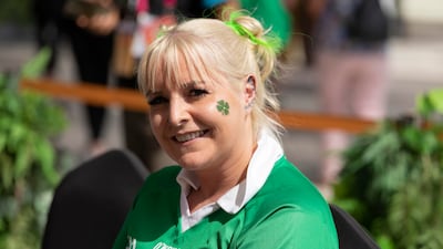 A woman - dressed all in green - attends the celebrations.