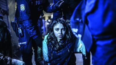 A young girl is pictured after she was wounded during clashes between riot police and prostestors after the funeral of Berkin Elvan, the 15-year-old boy who died from injuries suffered during last year’s anti-government protests in Istanbul on March 12. Riot police fired tear gas and water cannon at protestors in the capital Ankara, while in Istbanbul, crowds shouting anti-government slogans lit a huge fire as they made their way to a cemetery for the burial of Berkin Elvan. Bulent Kilic / AFP