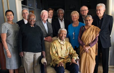 Former South Africa president Nelson Mandela, centre, is reunited with members of 'the Elders' in 2010, a group of retired leaders widely recognised as having moral authority and experience. AP