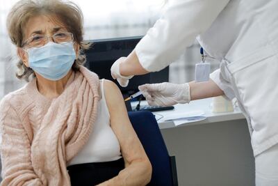 An elderly patient receives a dose of Pfizer/BioNTech Covid-19 vaccine. EPA