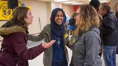 Democrat Ilhan Omar, centre, speaks to supporters while campaigning for US House district 5, in Minneapolis, Minnesota. EPA